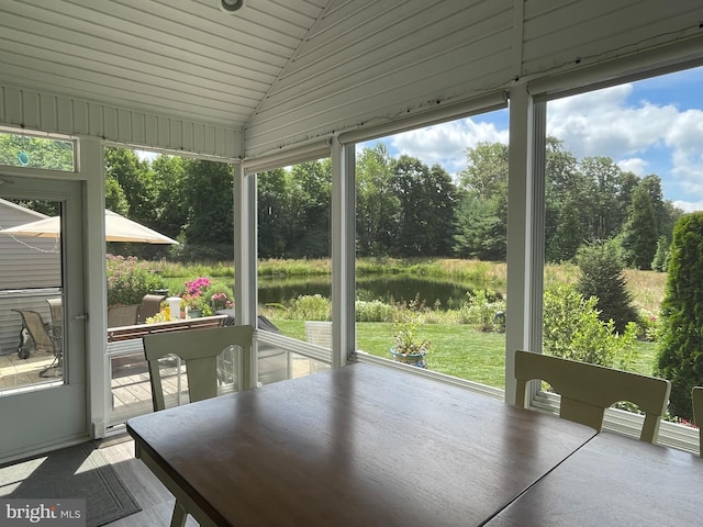 unfurnished sunroom with lofted ceiling