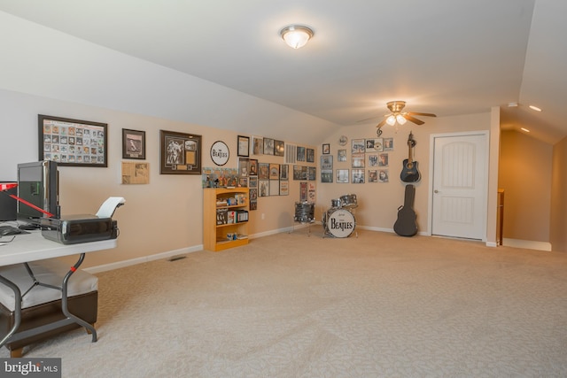 home office with lofted ceiling, carpet floors, and ceiling fan