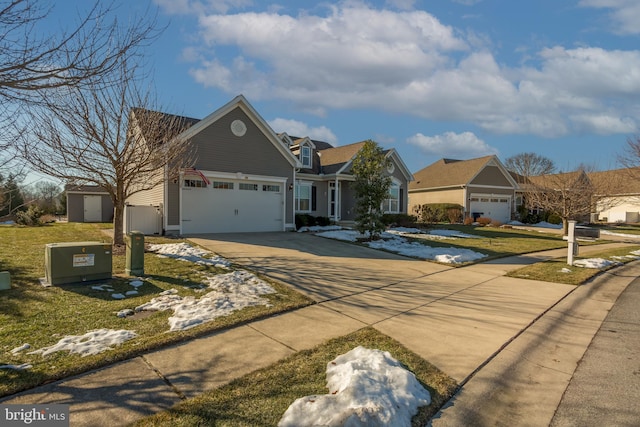 view of front of property with a garage and a front yard