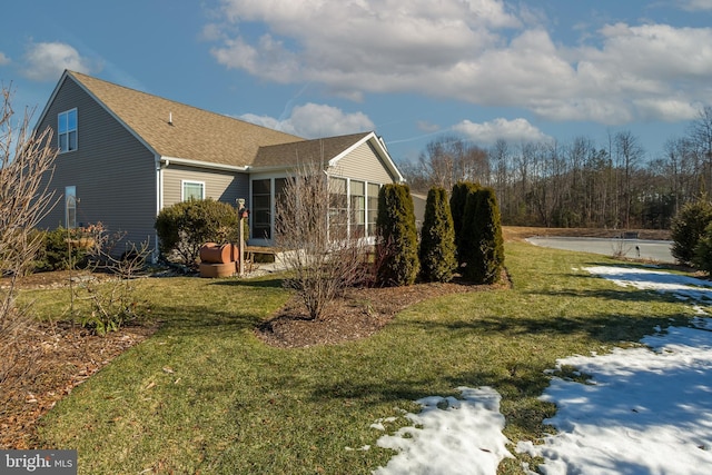 view of home's exterior with a lawn