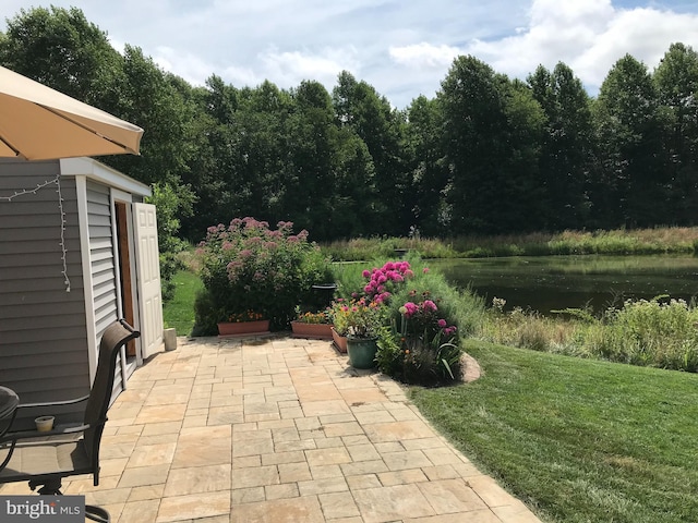 view of patio / terrace featuring a storage unit