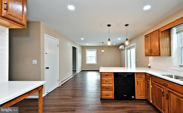 kitchen with a baseboard radiator, pendant lighting, black dishwasher, decorative backsplash, and kitchen peninsula