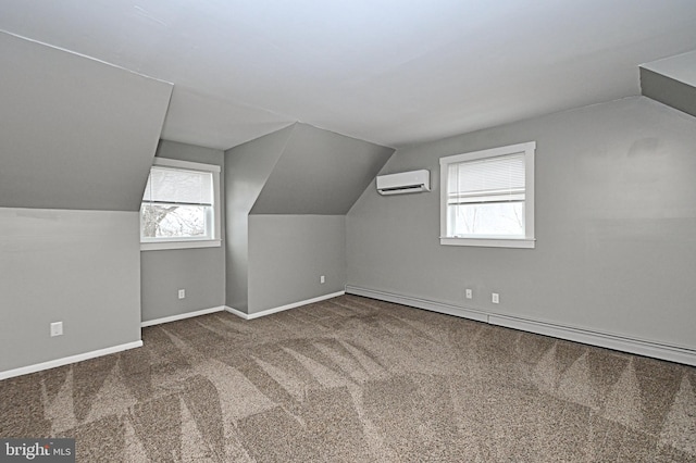 bonus room with a wall mounted AC, a healthy amount of sunlight, carpet floors, and a baseboard radiator