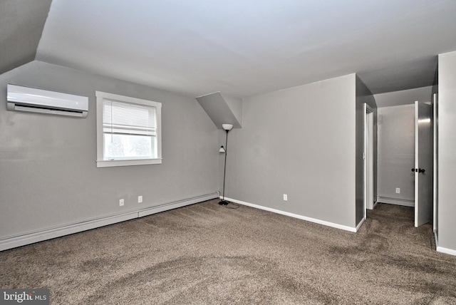 additional living space featuring an AC wall unit, baseboard heating, vaulted ceiling, and dark colored carpet