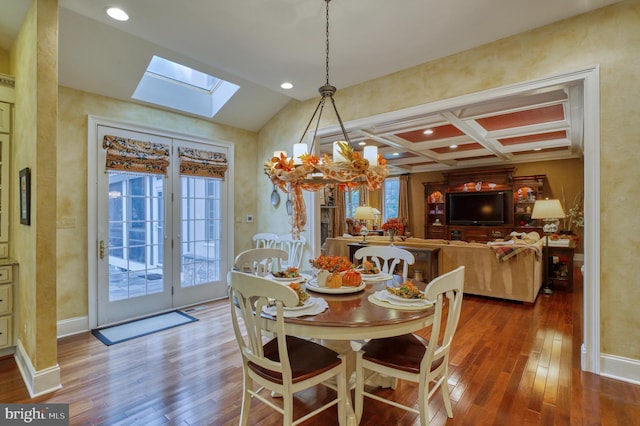 dining space with french doors, coffered ceiling, a skylight, beam ceiling, and hardwood / wood-style floors