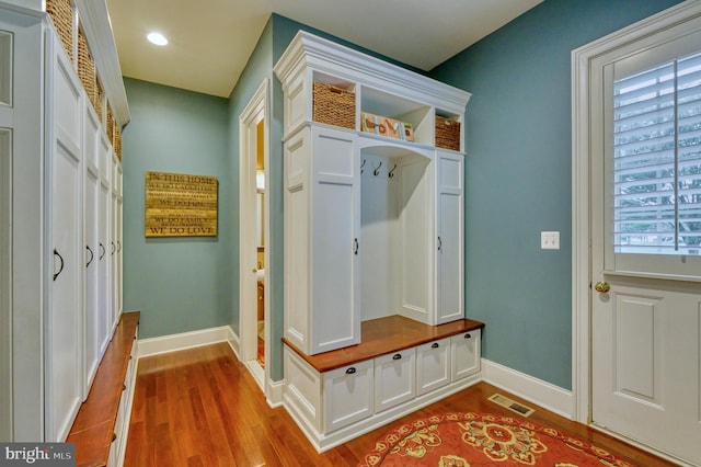 mudroom with light hardwood / wood-style flooring