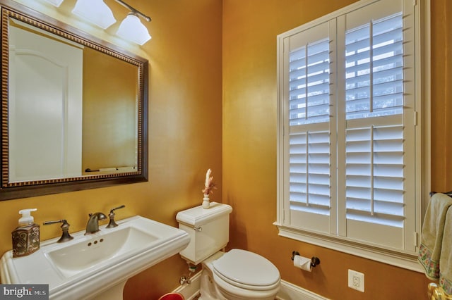 bathroom with toilet and sink