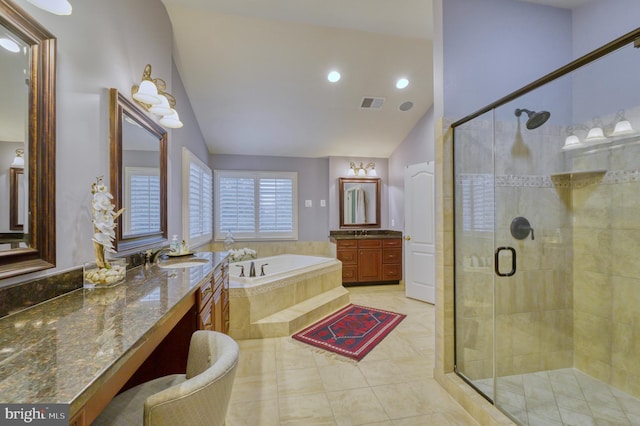 bathroom featuring shower with separate bathtub, vaulted ceiling, vanity, and tile patterned floors