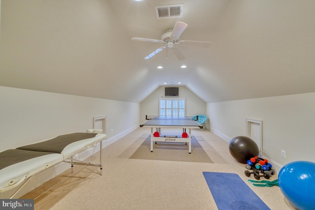 game room with ceiling fan, light colored carpet, and lofted ceiling