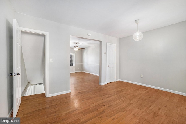 spare room featuring hardwood / wood-style floors and ceiling fan