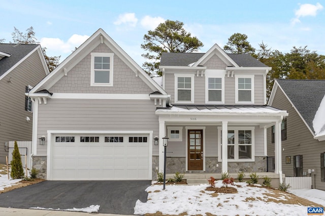 craftsman inspired home with a porch and a garage