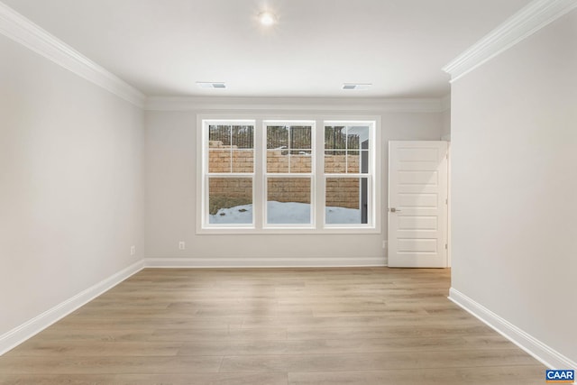 unfurnished room featuring light wood-type flooring and ornamental molding