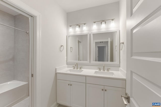 bathroom featuring vanity and tub / shower combination