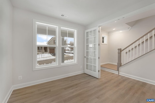 spare room featuring hardwood / wood-style flooring