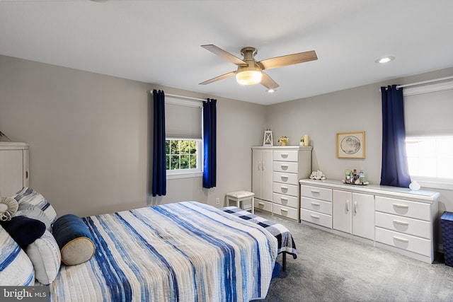 carpeted bedroom with ceiling fan