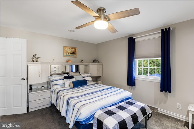 carpeted bedroom with ceiling fan