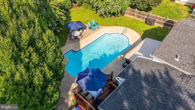 view of pool featuring a yard and a patio area