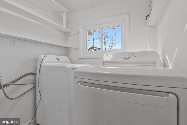 clothes washing area featuring washing machine and dryer