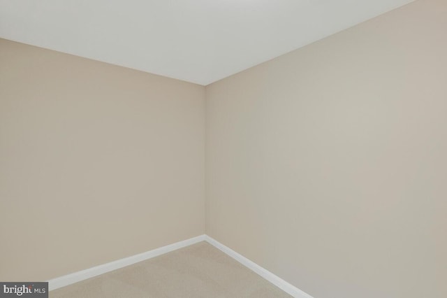 unfurnished room with carpet flooring