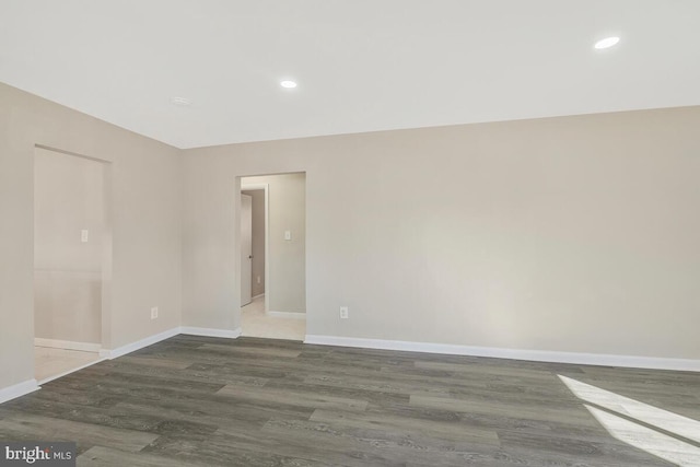 spare room featuring dark hardwood / wood-style flooring