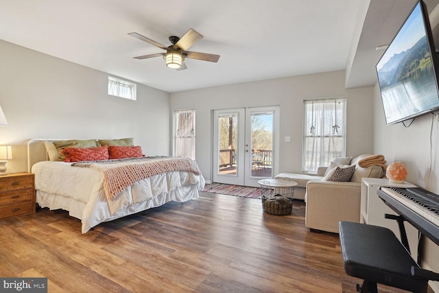 bedroom featuring access to exterior, hardwood / wood-style floors, french doors, and ceiling fan