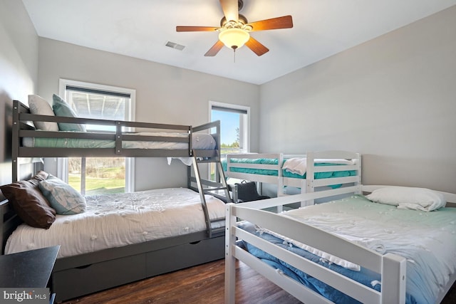 bedroom with dark wood-type flooring and ceiling fan