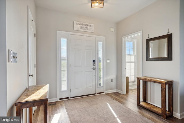 entryway with hardwood / wood-style flooring