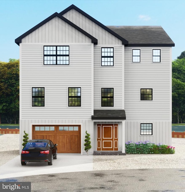 view of front of home featuring board and batten siding, an attached garage, and roof with shingles