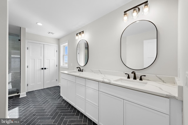 bathroom featuring double vanity, recessed lighting, brick floor, and a sink