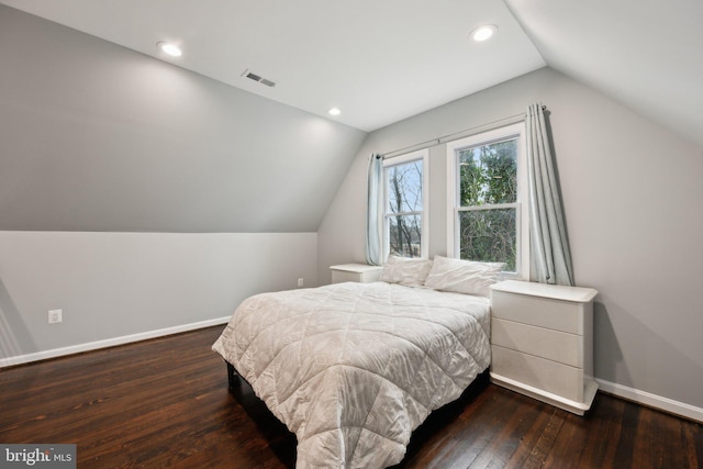 bedroom featuring vaulted ceiling and dark hardwood / wood-style flooring