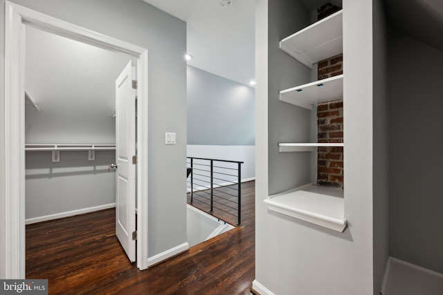 hallway with dark wood-type flooring