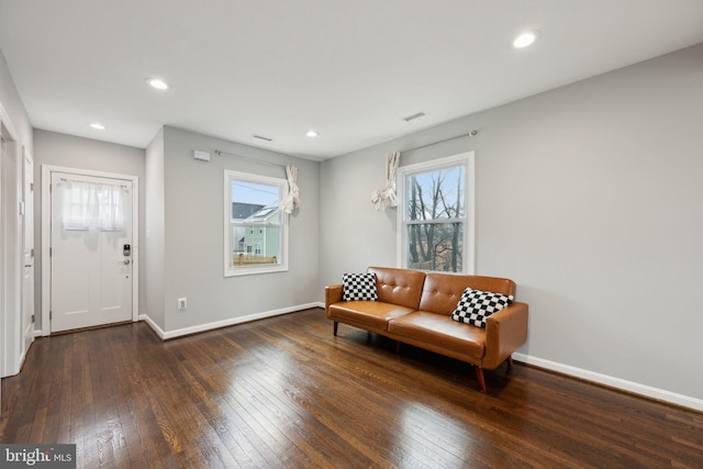 sitting room featuring dark wood-type flooring