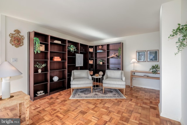 living area featuring light parquet floors