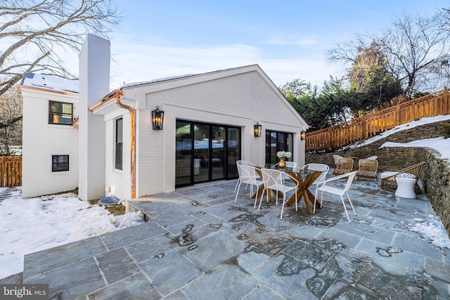 view of snow covered patio