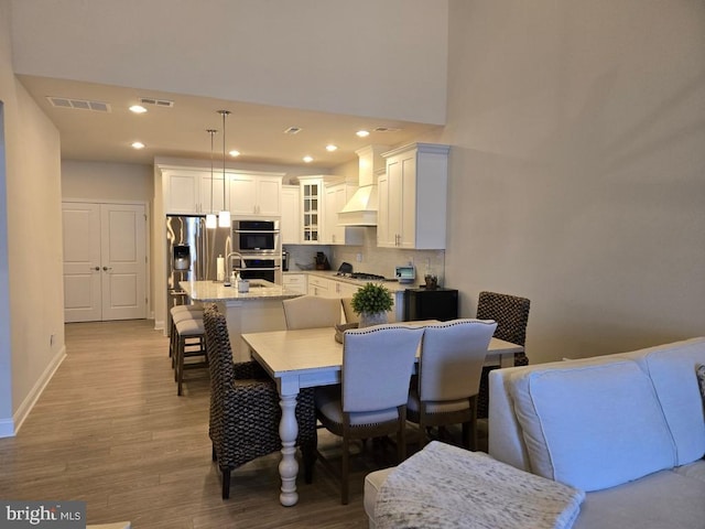 dining space with light wood-type flooring