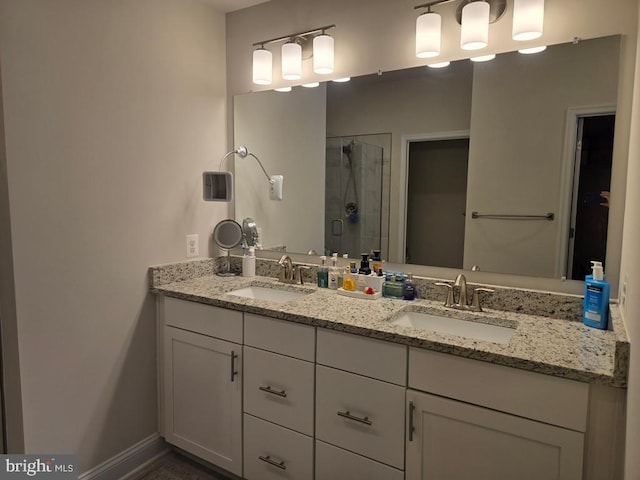 bathroom with vanity and a shower with shower door