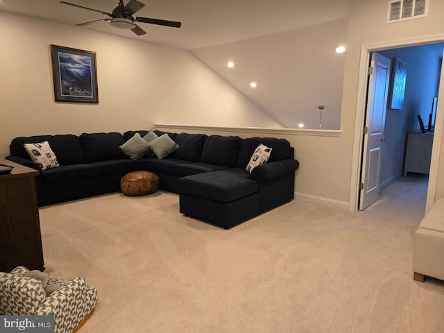 carpeted living room with vaulted ceiling and ceiling fan