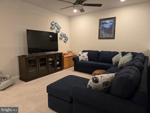 living room with carpet floors and ceiling fan