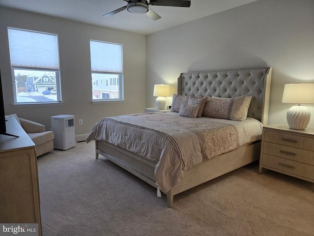 carpeted bedroom with ceiling fan