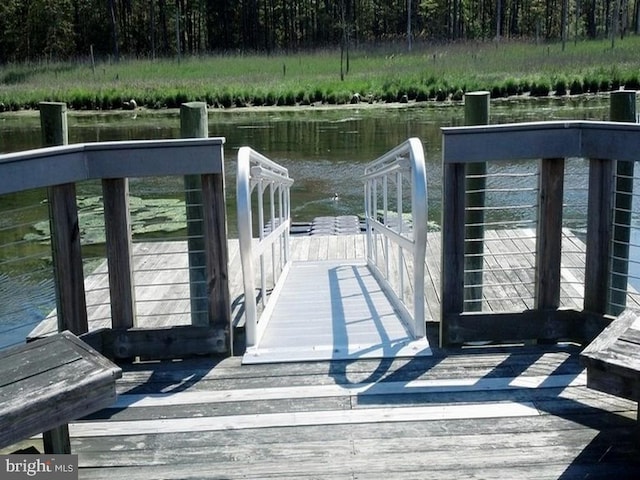 dock area featuring a water view