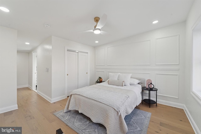 bedroom featuring light wood-type flooring and ceiling fan