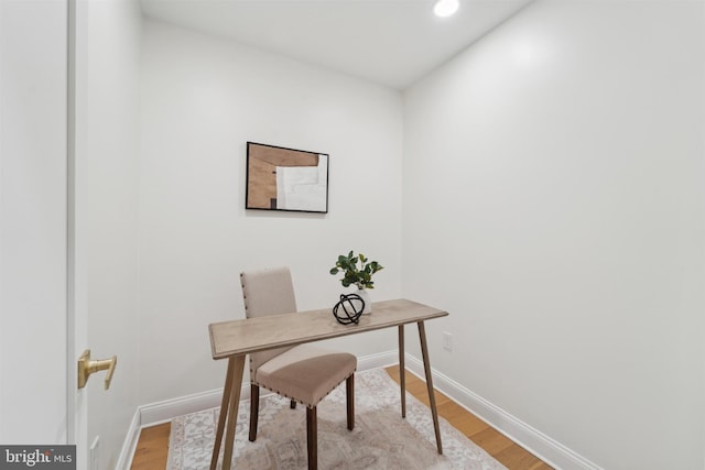 office space with light wood-type flooring