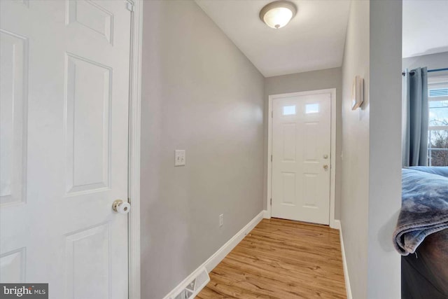 doorway to outside with light wood-type flooring