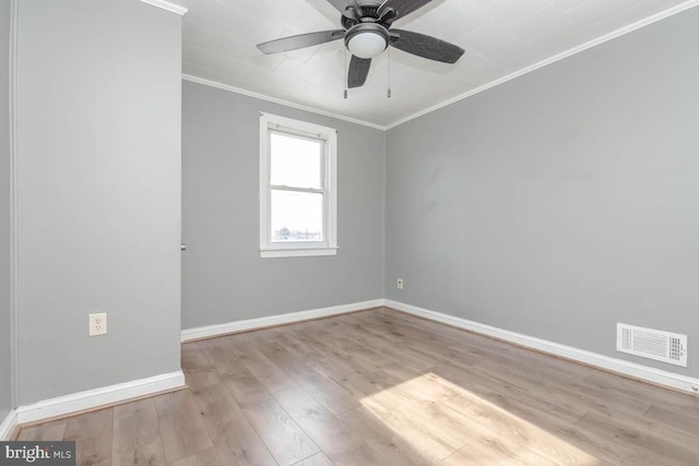 empty room with ceiling fan, ornamental molding, and light wood-type flooring