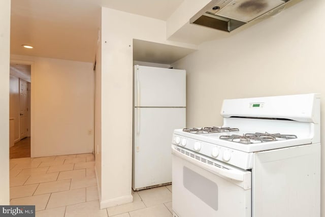 kitchen featuring extractor fan, light tile patterned floors, and white appliances