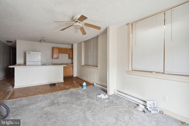 unfurnished living room with dark colored carpet, ceiling fan, a textured ceiling, and a baseboard heating unit