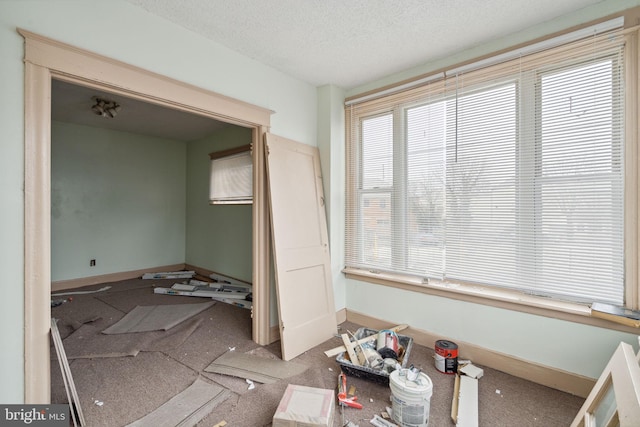 interior space with a textured ceiling