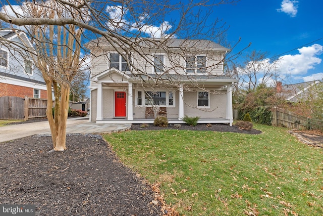 view of property with covered porch and a front lawn