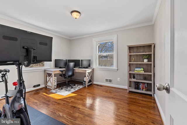 home office featuring dark hardwood / wood-style flooring and crown molding