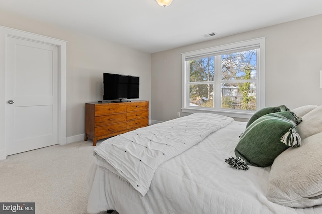 bedroom with light carpet